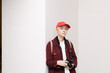 © rei wrd/Stocksy - portrait of young non binary person holding camera