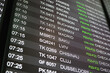 © Anna Berkut/Stocksy - screen with departure flights in airport, Madrid Baku Lviv