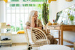 © Eloisa Ramos/Stocksy - Senior modern woman relaxing at home