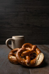 Wall Mural - oktoberfest food with pretzels and beer background