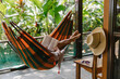 © Raymond Forbes Photography/Stocksy - Afternoon Book Reading in Hammock on Porch