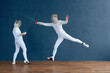 © Danil Nevsky/Stocksy - Energetic fencers fighting in gym
