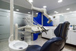 © David Prado/Stocksy - Chair in dental cabinet