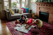 © Erin Brant/Stocksy - Father and boys studying map