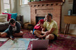 © Erin Brant/Stocksy - Dad and sons plan family trip