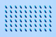 © Marc Tran/Stocksy - Capsule pills pattern on a blue background