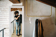 © Javier Díez/Stocksy - Man choosing outfit at home