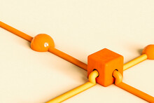 Orange And Yellow Tubes Connecting With A Cube