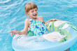 © Ivan Gener/Stocksy - Laughing little girl playing in a swimming pool