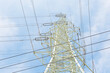 © Jeongho Byeon/Stocksy - Power tower wires intersect in the blue sky