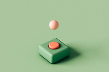 Green And Pink Button With A Pink Sphere
