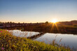 © edb3_16 - Bridge going over a river in a city park. Sunny Summer Sunset. Colony Farm Regional Park, Port Coquitlam, Vancouver, British Columbia, Canada.