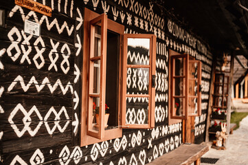 Cicmany, Slovakia - june 08, 2021: Old wooden houses in Slovakia village Cicmany, traditional painted with white paint. Cicmany, Slovakia