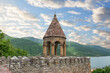 Ananuri fortress. Ancient architecture against the backdrop of a lake, forest and blue sky.