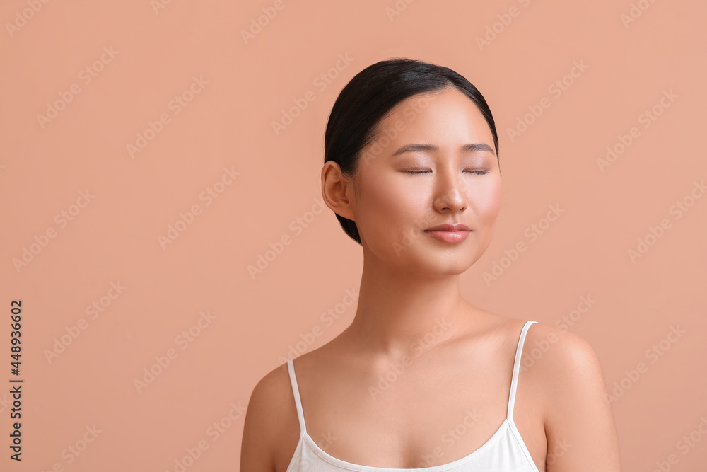 Beautiful young woman on color background