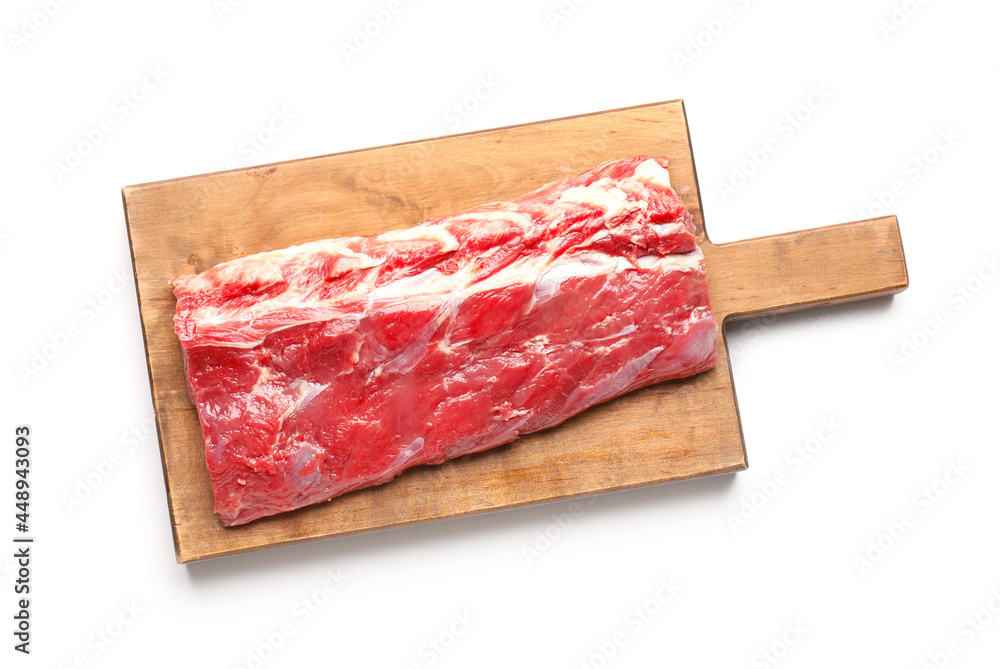 Wooden board with raw beef brisket on white background
