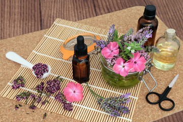 Canvas Print - Herbal plant medicine preparation with herbs and flowers used in making aromatherapy essential oils. Natural alternative health care concept.