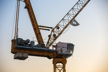 Sticker - Crane working on a building construction site.