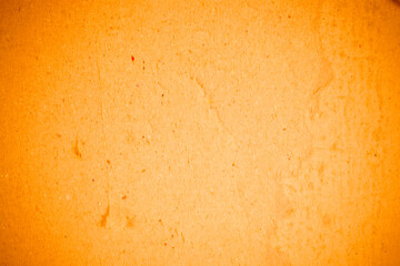 Torn orange paper recycling cardboard texture.