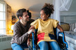 © NDABCREATIVITY - Happy multiethnic family. Smiling little girl with disability in wheelchair