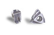 metalworking carbide insert triangle. special tool. front and side view photo. Used auto turning machine. Material micro alloy coating. Isolated on white background.