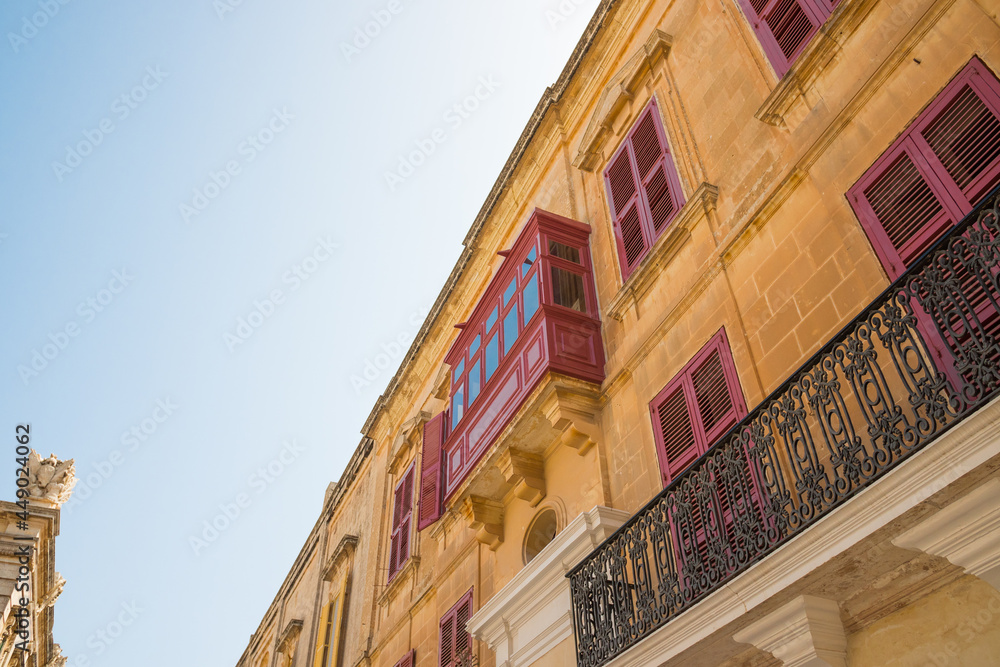 Low-angle shot of aa building with typical bow windows in Malta Stock ...