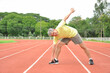 © Verin - an old man warming up exercise before running or jogging, concept health care in elderly people