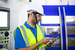 © winnievinzence - Male engineer of technician worker using digital tablet control on modern machine in plant factory. labor and industrial concept