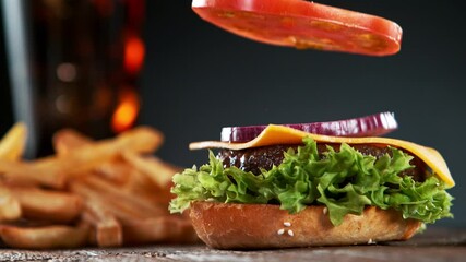 Wall Mural - Beef Burger Ingredients Falling and Landing in the Bun. Super Slow Motion at 1000 fps.