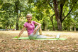 © littlewolf1989 - Senior caucasian woman stretching her fit body warming up and preparing for training in nature.