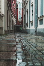 Empty Narrow Passage Between Buildings, Streets After The Rain