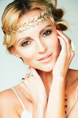 Poster - young blond woman dressed like ancient greek godess, gold jewelry close up isolated, summer trends