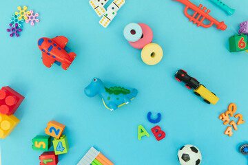 Wall Mural - Background with different wooden and plastic kids toys