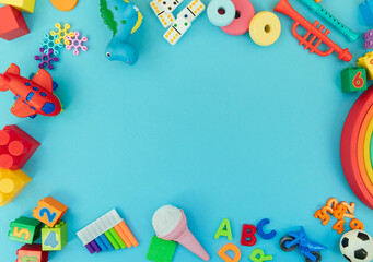 Wall Mural - Background with different wooden and plastic kids toys