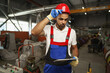 © fotofabrika - African american male manager in electric cable warehouse holding digital tablet