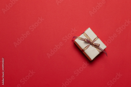 New Year Christmas surprise present handmade gift box on red background. Template greeting card.