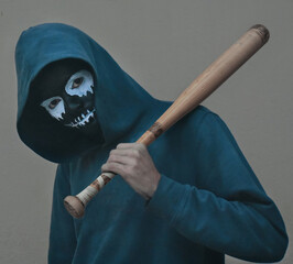 Poster - Young male with scary black and white skull face paint posing with a baseball bat