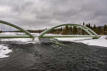 Sticker - Bridge over the water covered in ice and snow on a cold gloomy winter day