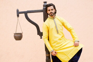 Young male model in yellow kurta