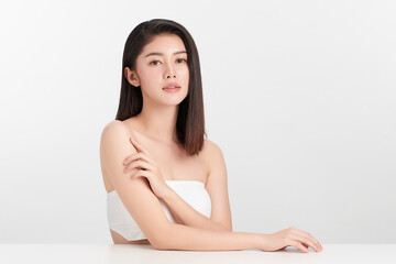 beautiful young asian woman with clean fresh skin on white background, face care, facial treatment, 