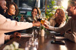© Southworks - Friends toasting with wine in bar