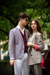 © alipko - Young fashion man and stylish young woman in a formal suit outdoor in the city