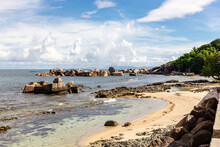 Pointe Cocos Coastline With Granite Rocks Sticking Out From The Ocean, Praslin Island, Seychelles.