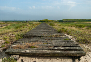  Old wooden pathway in the countryside with a beautiful misty sky - Costa Nova Beach, Aveiro, Portugal, 10.06.2021