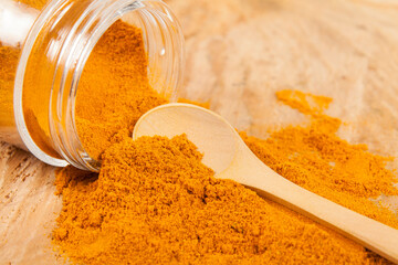 Fresh organic root and turmeric powder - Curcuma longa; Healthy Food.