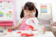 © M-image - young  girl pretend play food preparing at home