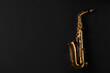 © New Africa - Beautiful saxophone on black background, top view. Space for text