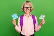Photo of young happy positive charming boy wear glasses bag bad good grade isolated on green color background