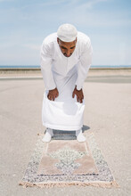 Muslim Man Praying On Beach