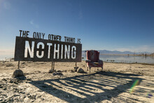 Rustic Sign And Old Chair On The Road To Bombay Beach, During Daylight
